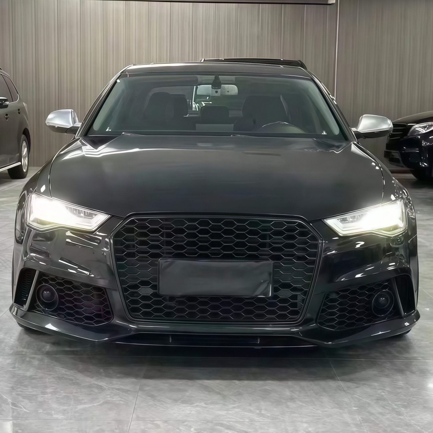 Suitable for Audi A6L models from 2016-2018, this is an upgrade kit for modifying the front bumper to resemble the RS6, including the front grille and bumper