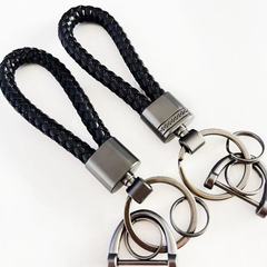 カップルのシンプルなキーホルダーのアイデアは純粋な手作りの編み紐と自動車のキーホルダーのキーホルダーのペンダントです。