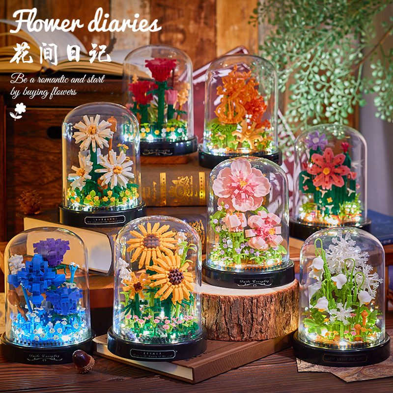 積み木の花がバラのオルゴールを飾っています。|undefined