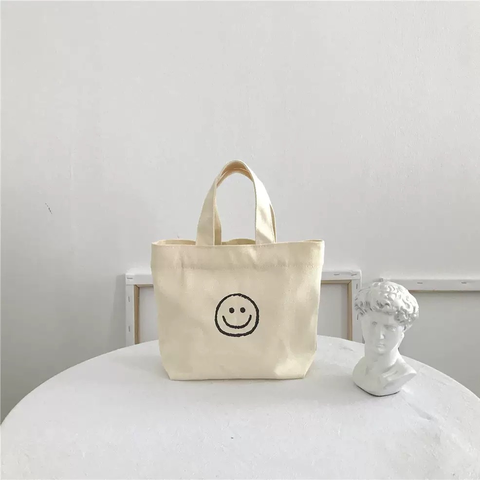 Beige smiley handbag 17*20*26