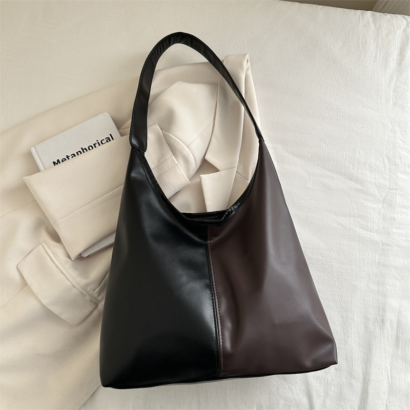 Bolsa de mujer de gran capacidad, textura de 2024, nueva moda simple, bolsa de hombro universal, bolsa de brazo de viaje de color.