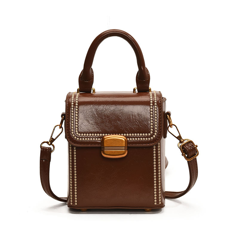 Retro versátil bolso de mano para mujeres 2025 nuevo nicho de alto nivel sensación de hombro mochila de moda bolso móvil