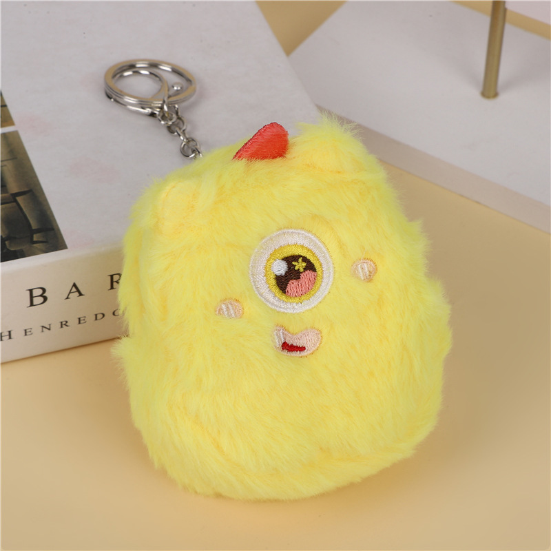 B118 Monster llavero - ojos marrones amarillos