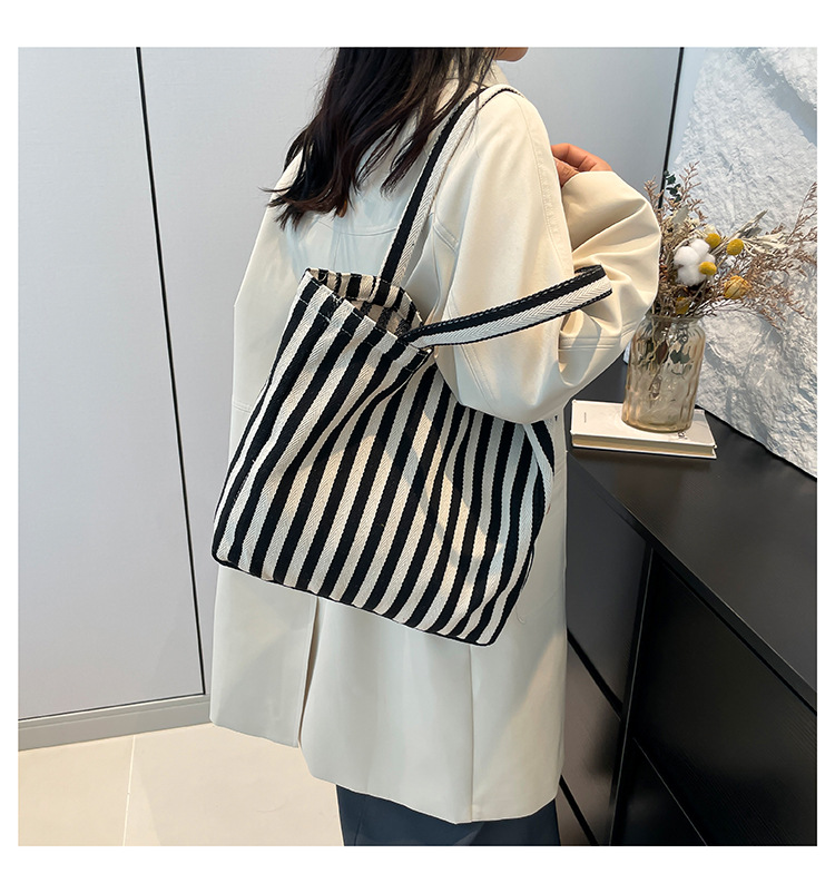 2024 Autumn/Winter new versatile and fashionable striped handbag shopping bag, two-tone large-capacity trendy single-shoulder bag undefined