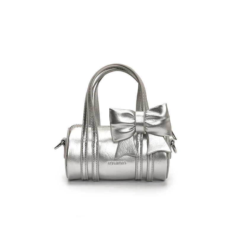 Bolso cilíndrico para niña de color sólido simple bolso de bebé con lazo dulce y lindo 2025 moda mini bolso para niños