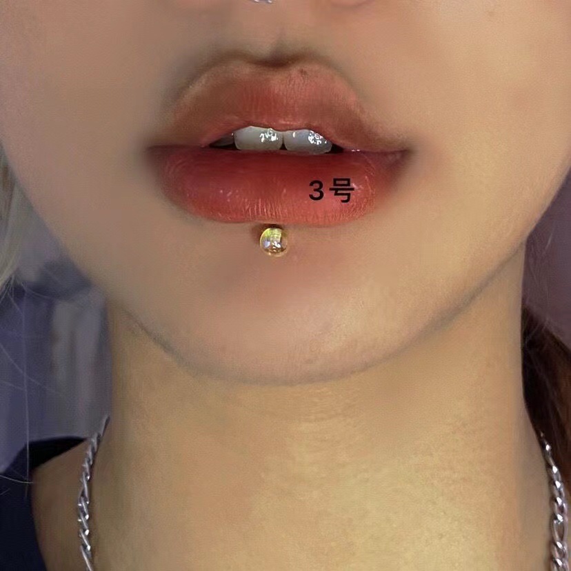 Silver pointed spike labret stud material detail