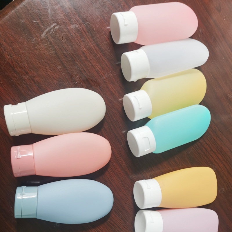 Cosméticos Viajes Subbotella Manguera Juego de extrusión Botella de champú portátil Botella de loción extruida con tapa abatible 60ml