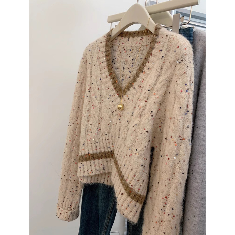 Mujeres coreanas envejecen y cuello alto único manteniendo cálido suéter casual suéter de diseño de otoño y invierno sensación de nicho camiseta de punto