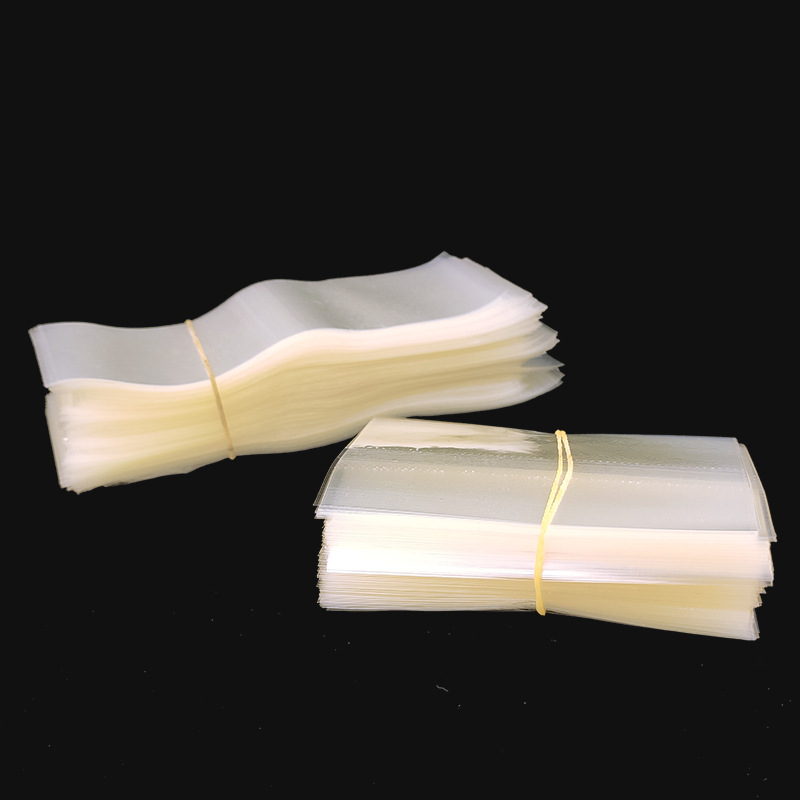 Botella de PVC boca película Termocontraíble fácil de rasgar película traga película de sellado de botella Etiqueta de película retráctil de dos extremos en stock al por mayor