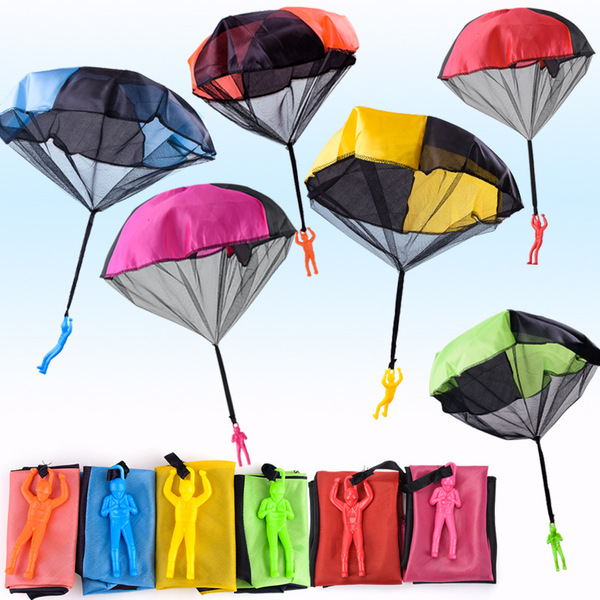 Spot children hand tossing parachutes