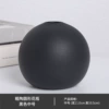 Rough pottery ball black medium