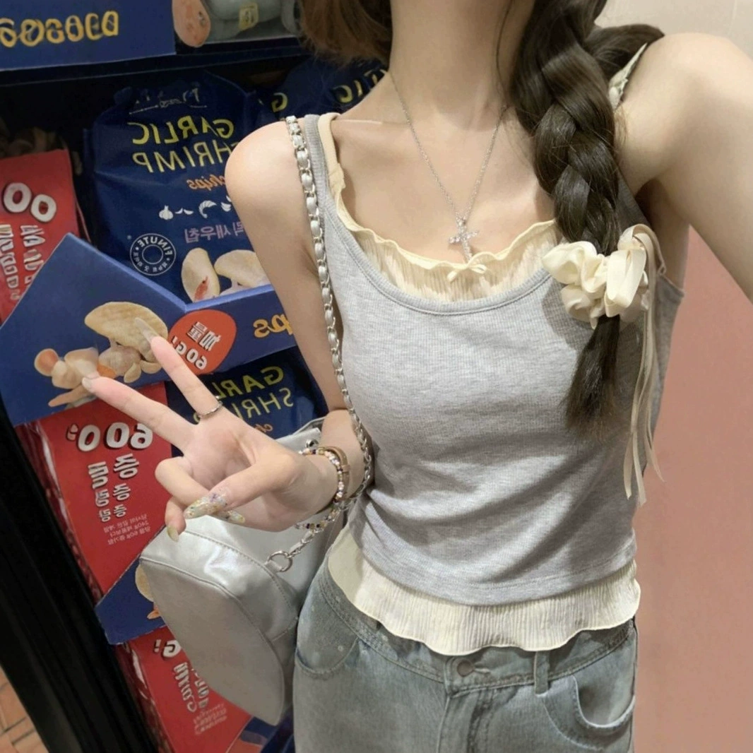 Конкурентный цвет тонкий, поддельные две части, чтобы покрыть мясо женщины летом новый нишевые дизайн тонкий ремень, подтяжка, жилет, блузка