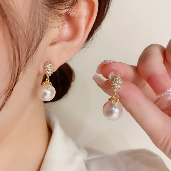 Sophisticated small fashionable elegant earrings drop-shaped from…