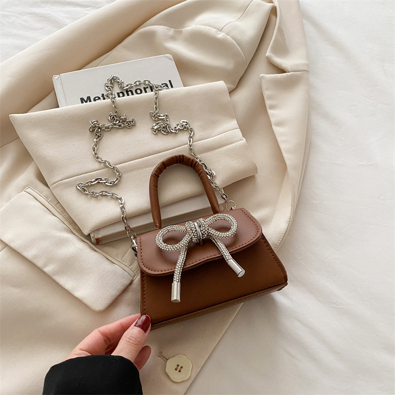 Bowknot Fashion versión coreana de estilo occidental pequeño bolso cuadrado bolso femenino 2025 verano nuevo bolso de cadena de viaje salvaje mujer