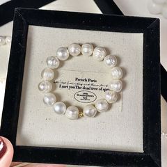 バロック真珠のブレスレットの大きい真珠のねじの強い光の天然の真珠の弾力の縄の手の串の不規則な異形の金属