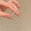 Ring with zircon pearl