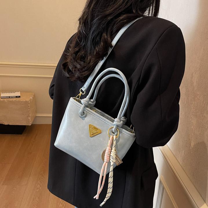 Bolso de mano simple de estilo extranjero para mujeres 2025, nuevo bolso de cubo de alta calidad, bolso de hombro casual simple