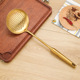 Gold [large colander]