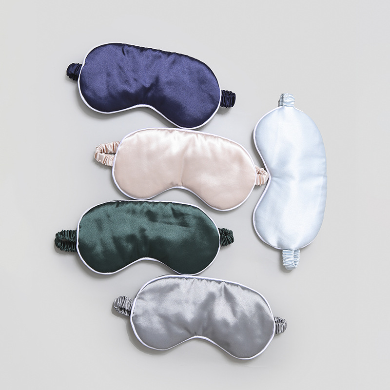 Máscara de ojo de seda artificial máscara de ojo de viaje de aire al por mayor Fábrica de sombreado correa elástica de viaje almuerzo máscara de ojo borde blanco