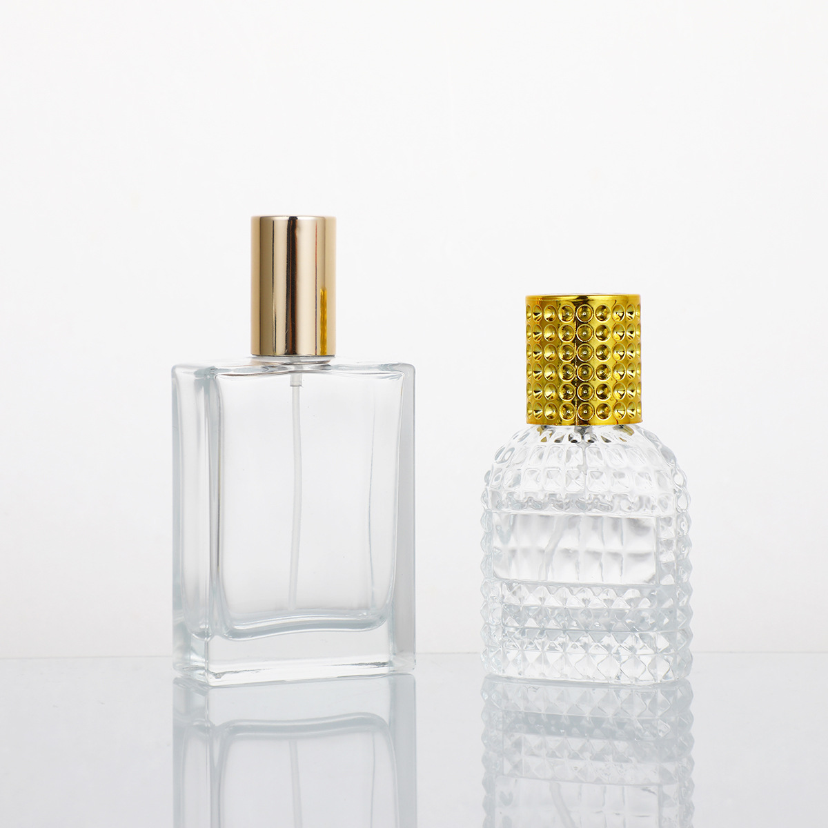 Botella de perfume de vidrio transparente de alto valor 50ml botella de aerosol de aceite esencial cosmético botella vacía botella de muestra de perfume