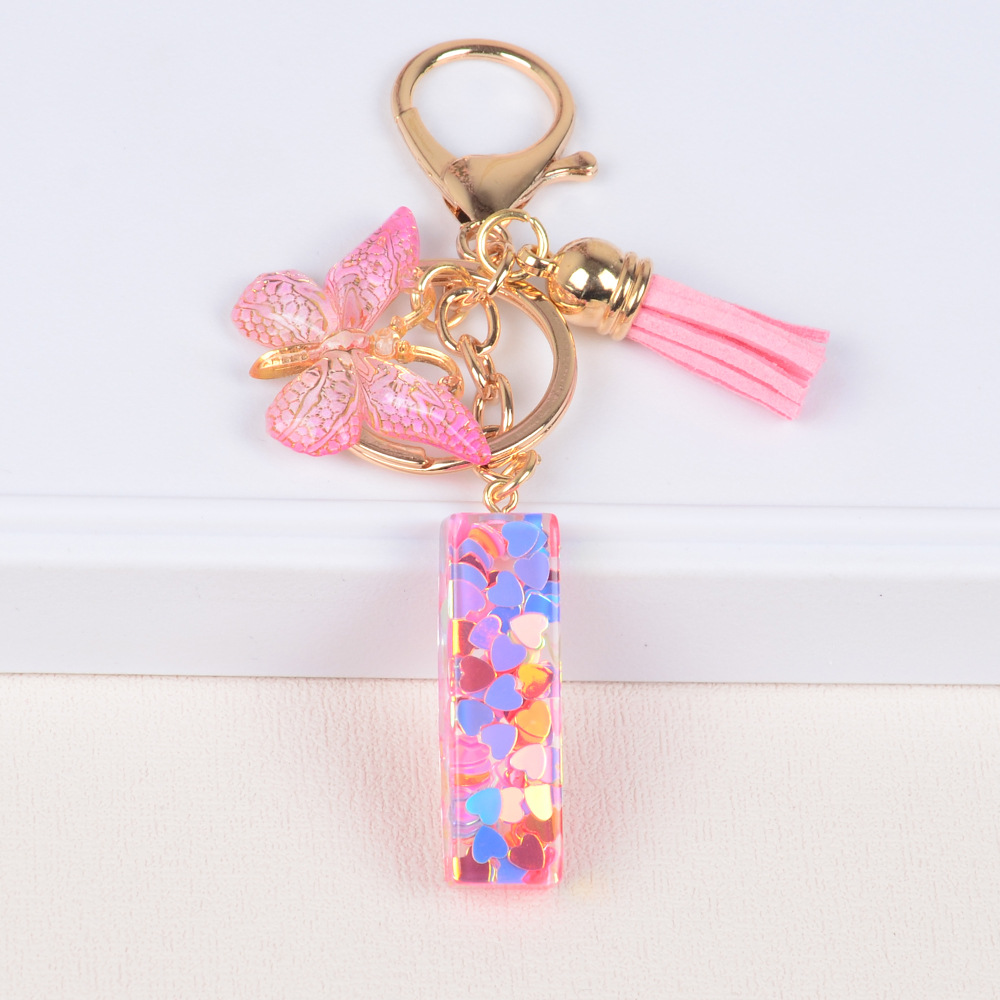 Explosiones transfronterizas amor sequillas iniciales llavero al por mayor resina letra mariposa fringe llavero se puede personalizar