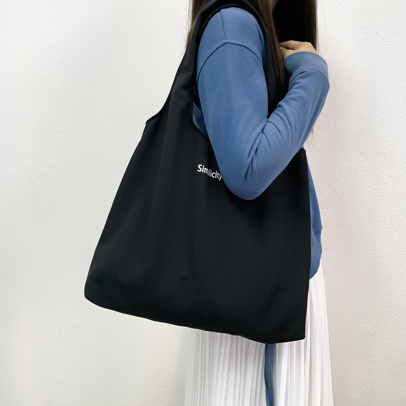 秋冬キャンバスバッグ黒色アルファベットベストバッグ大容量旅行休暇バッグ学生授業バッグバッグショッピングバッグ