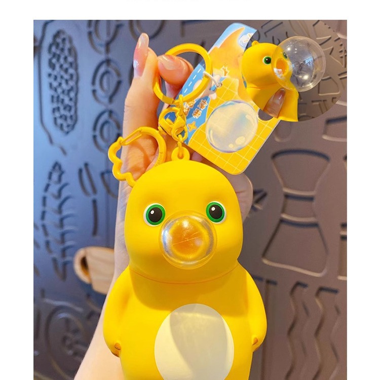 Online Celebrity schoolbag adornos genuino descompresión burbuja leche dragón llavero femenino exquisito creativo pellizcar música colgante clave