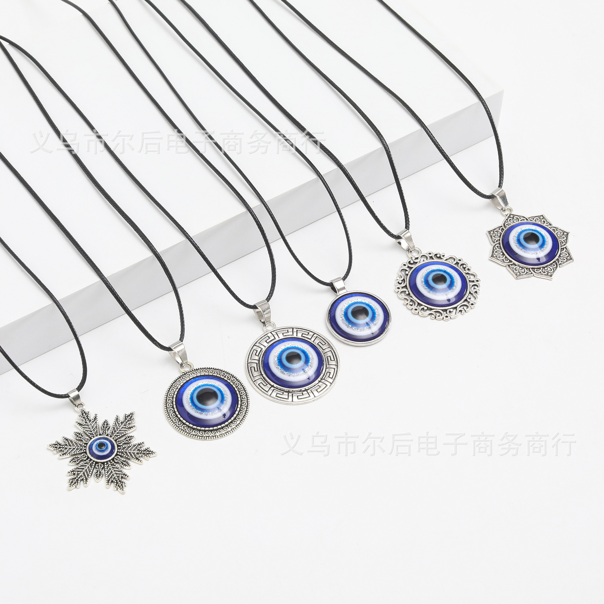 Joyas transfronterizas europeas y americanas retro turcas aleación redonda azul colgante ojo del diablo colgante ojos azules al por mayor
