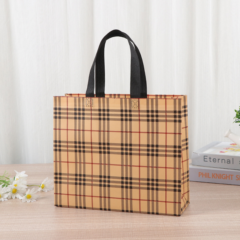 Bolsa de tela no tejida portátil gruesa bolsa de embalaje tridimensional resistente al desgaste de gran capacidad de equipaje de dormitorio de estudiantes bolsa de mano
