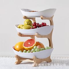 竹の多層の果物の皿の棚の木製のフロントのキャンディーの棚の家庭のリビングルームのお茶のお菓子の棚の乾燥した果物のトレーの棚