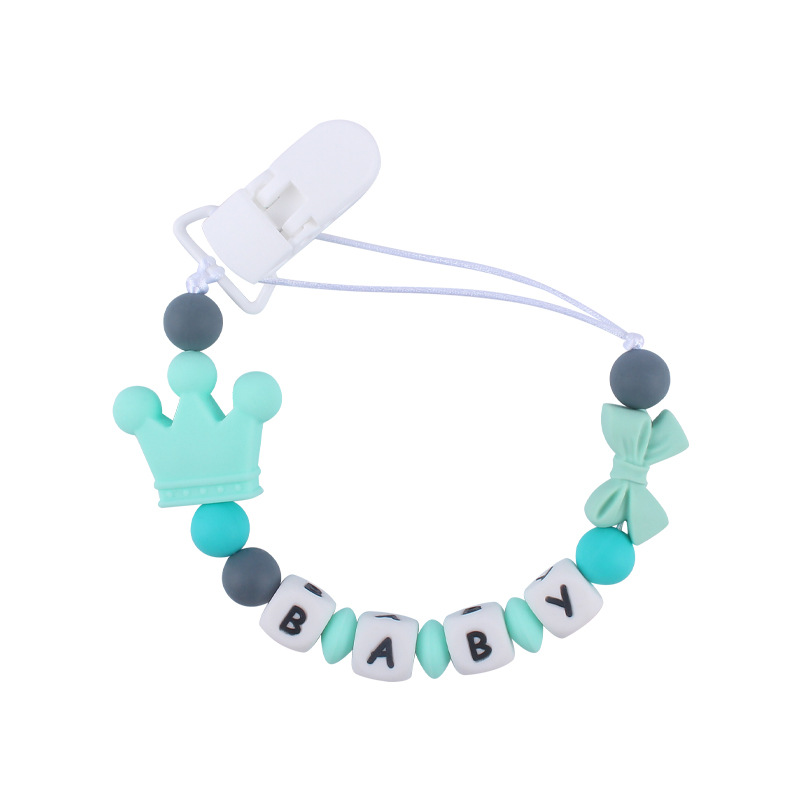 Suministros de bebé corona de dibujos animados cadena anti-gota bebé creativo DIY silicona mordedura pegamento molar chupete cadena