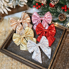 クロスボーダーはクリスマスの蝶結びの新型のスパンコールの蝶結びのクリスマスツリーの装飾品のペンダントの場所の配置を提供します。