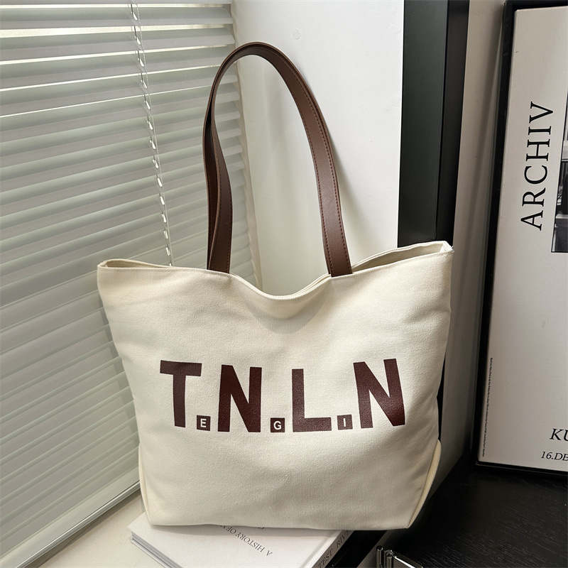 Bolsa de lona de gran capacidad para mujeres 2025, primavera y otoño, nueva literatura y moda, bolso de hombro, letras casuales, bolso de viaje