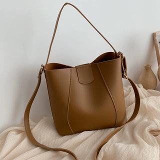 法国晓曼包包女2021新款简约清新单肩包时尚流行女包斜挎水桶包潮