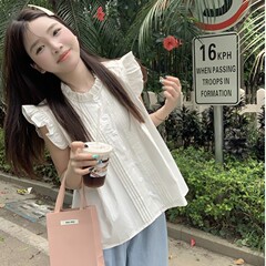 フランスの小さい飛の袖の白い格子のシャツの小さい大衆の女性の夏の袖なしはやせている甘い子供のシャツの短い上着を現します。