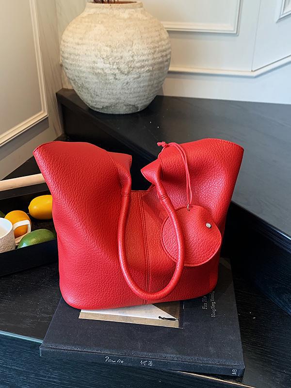 Bolso de cubo de axila de estilo explosivo transfronterizo para mujer 2025 nuevo bolso de hombro de cuero suave de viajero salvaje simple bolso de niño y madre de todo fósforo
