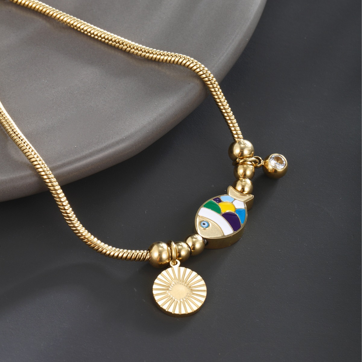 Xuping joyería colorido goteo de aceite pez dorado bordilla columna de hueso de serpiente chapado 14 quilates de oro cruzado Europa y América pulsera de acero inoxidable