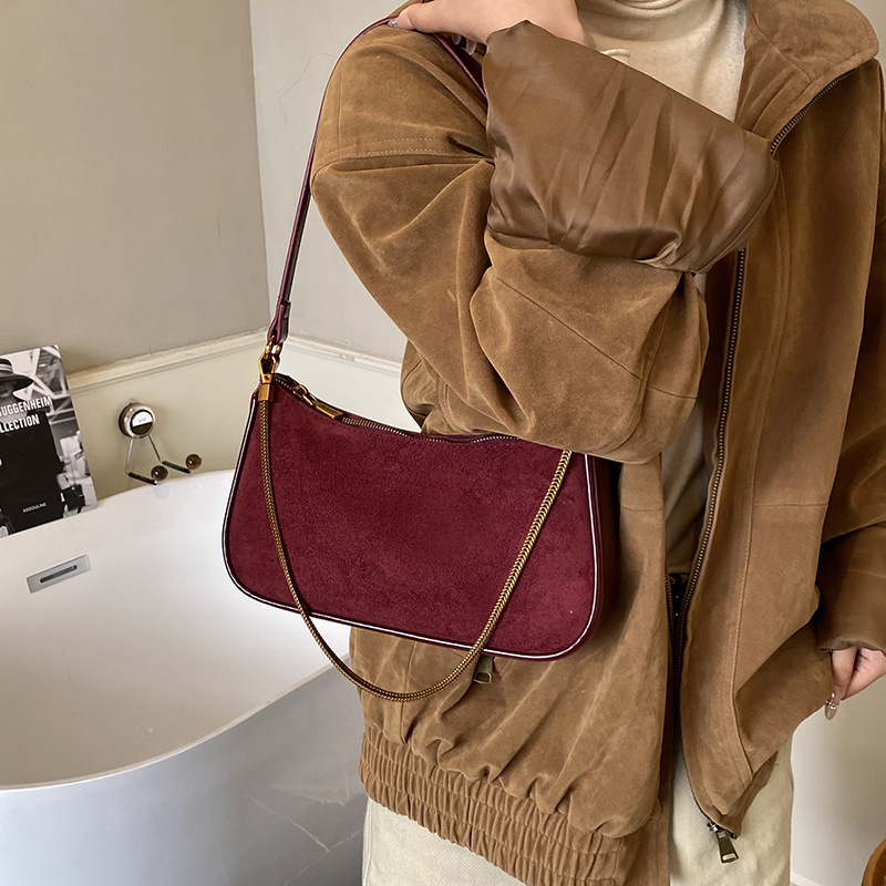 Corea del Sur de cuero de seda bolsos de mano bolsos de mano mujeres 2025 nueva moda cadena de hombro mochila bolsos de palo