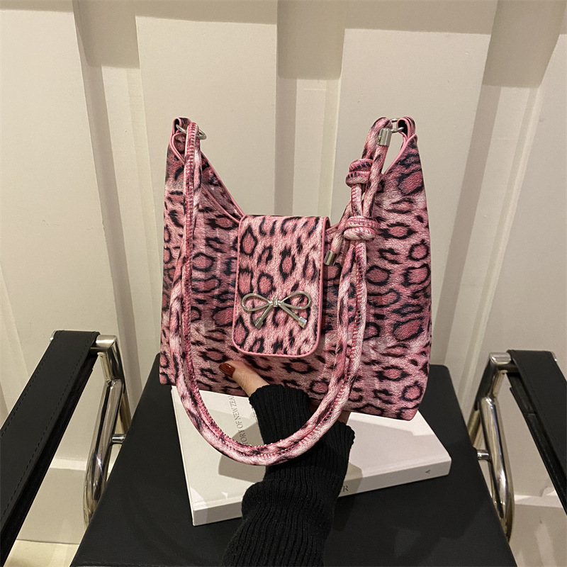 Leopardo arco brazo bolso para mujeres 2024 otoño nuevo nicho de diseño simple bolso de hombro exterior