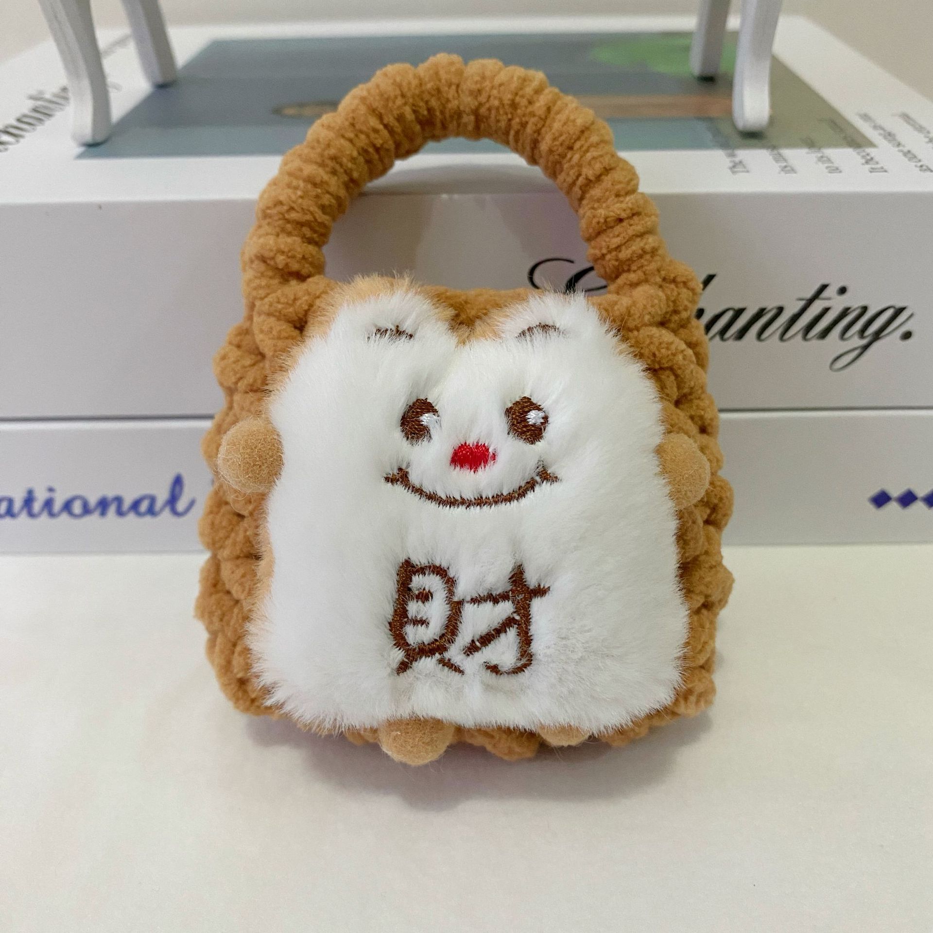 Celebración de Año Nuevo gran león rojo despertar dragón muñeca de peluche dibujos animados tejido a mano bolsas de auriculares Bluetooth bolsas de cambio al por mayor