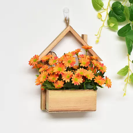 Wooden house + orange daisy