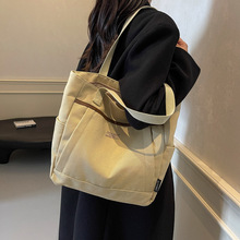 流行学生帆布包2024新款时尚大容量手提单肩书包睿营腋下包包女包