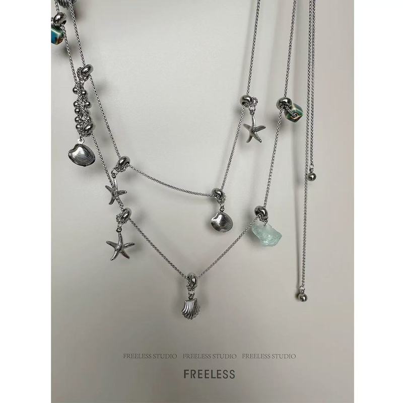 ニッチなデザインのチタン鋼ネックレスペンダントヒトデシェルタッセルセーターチェーン女性用、ハイエンド、ユニークで多用途な個性|undefined