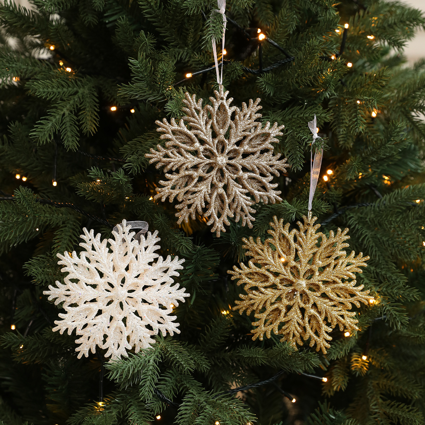 Colgante de árbol de Navidad transfronterizo polvo de oro copo de nieve plástico hueco tridimensional diseño de decoración de Navidad doble cara