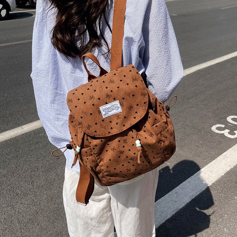2026 mochila de viajes escolares de gran capacidad para mujeres coreanas frescas pequeñas ondas de diseño de moda mochila de moda mochila de moda