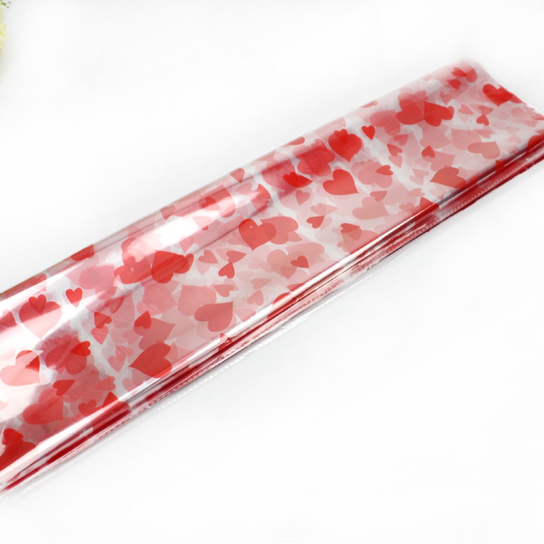 Flor envuelta en celofán impresión papel de plástico papel de regalo papel de embalaje transparente de Apple regalo flor material de embalaje al por mayor