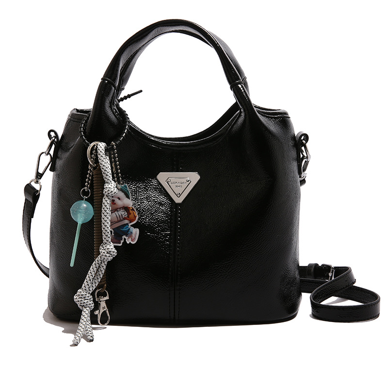 Bolsa de cubo de mano explosiva de comercio exterior para mujeres 2025 nueva moda bolsa de hombro ocio para viajar al trabajo de alta calidad bolsa madre