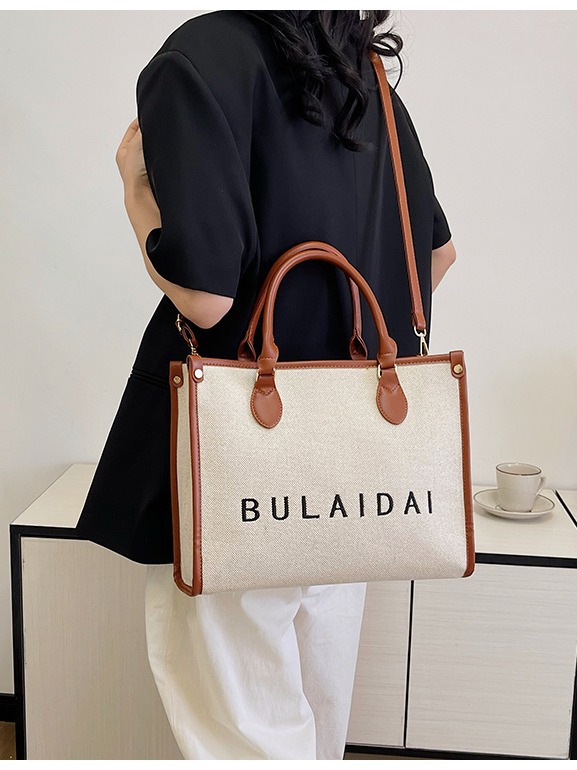 Bolsos para mujer 2026, nuevo estilo de moda, bolso tote de lona con logo bordado, bolso de mano de alta gama, bolso bandolera para el día a día