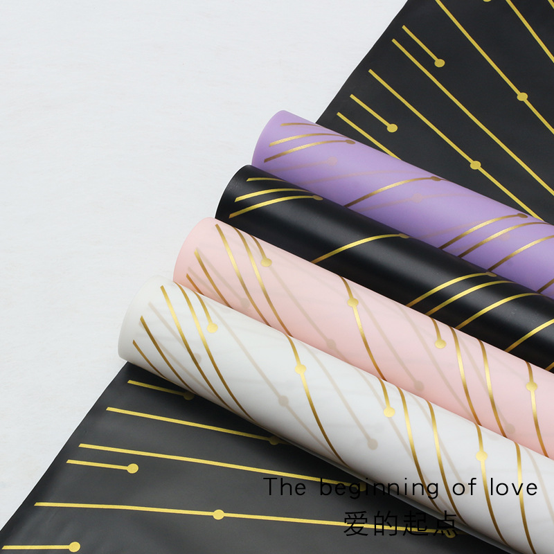 Huaxi transfronterizo amor punto de partida de papel de embalaje de flores Hansu impresión de hilo de oro impermeable papel de niebla florista al por mayor