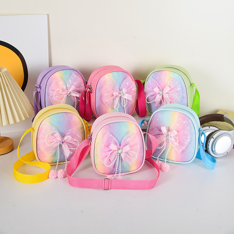Bolsa de hombro de niñas de arco de encaje, mini bolso arco iris brillante de PU, nuevo bolso de cambio para niños transfronterizos